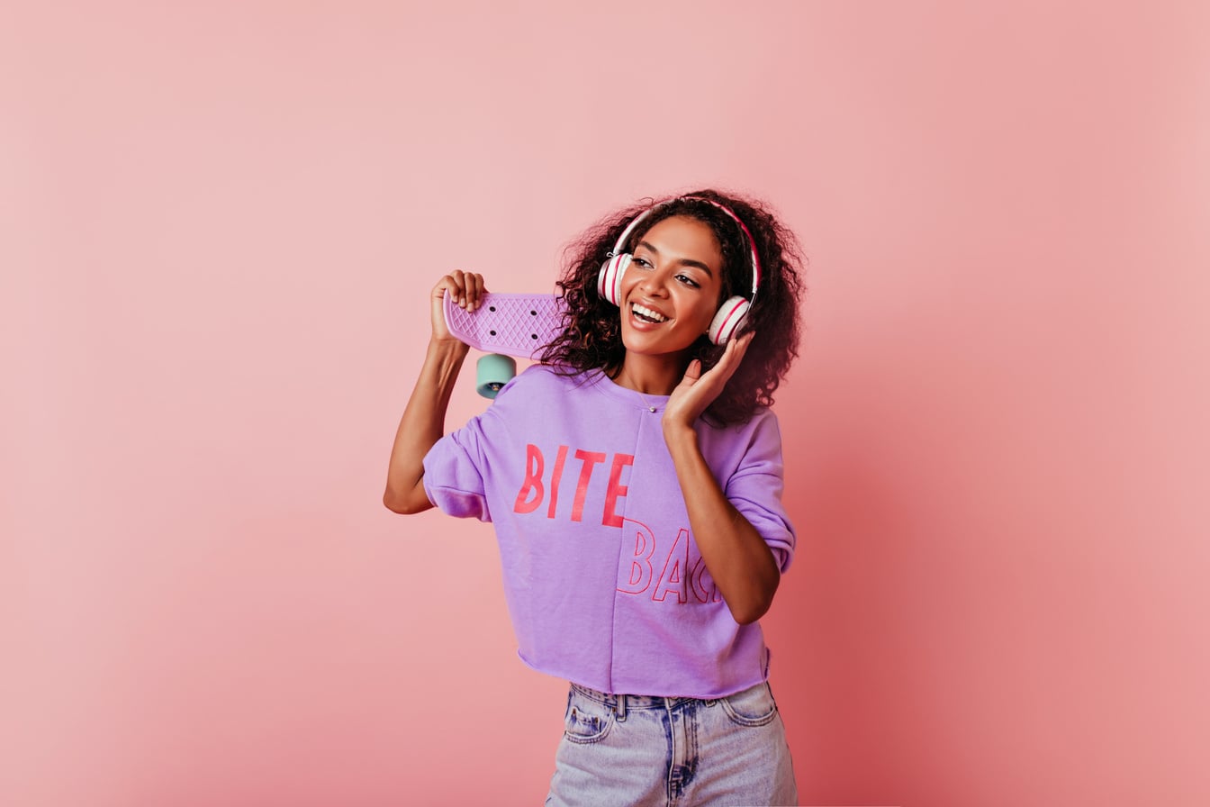 Elegant Black Girl in Good Mood Enjoying Music and Dancing. Gorgeous Curly African Lady Having Fun in Studio.